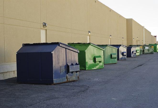 construction dumpsters stacked in a row on a job site in Hazelwood